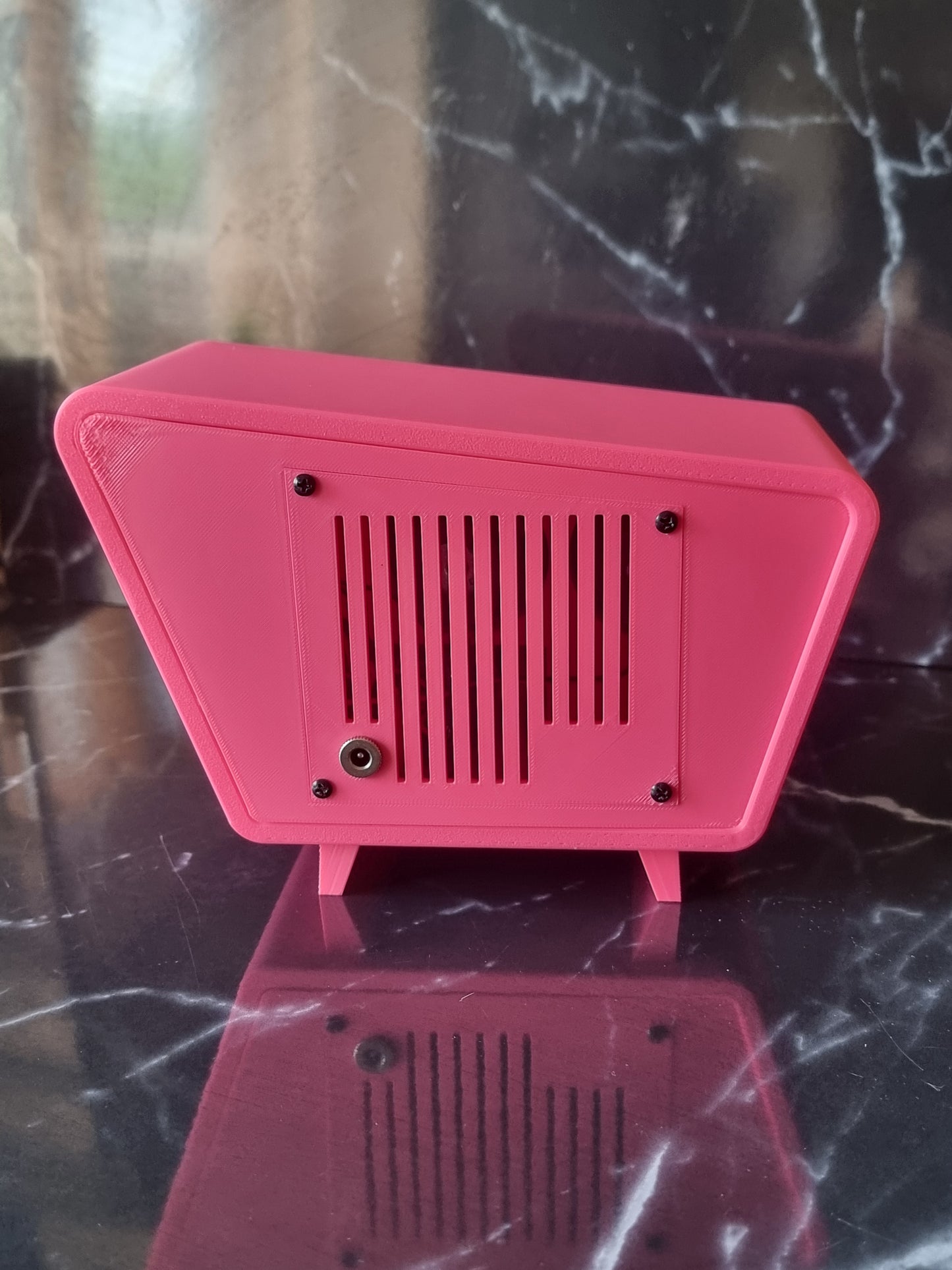 The Jetson, Retro Bluetooth device. Vintage style speaker. 1950s. Pink